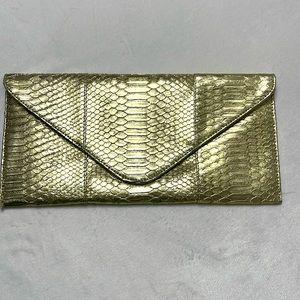 Gold envelope clutch purse. Very good condition.